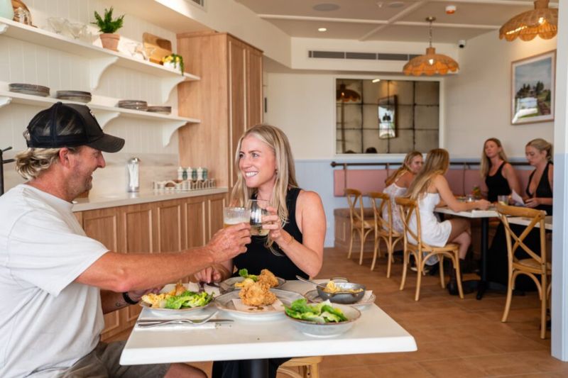 Couple enjoying meal at Hatched Bokarina