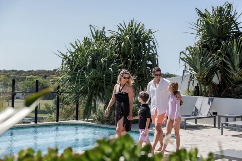 Family walking by pool at Zinc Bokarina